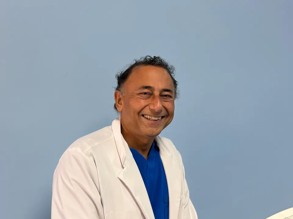 Rajesh Khanna, MD in a white coat